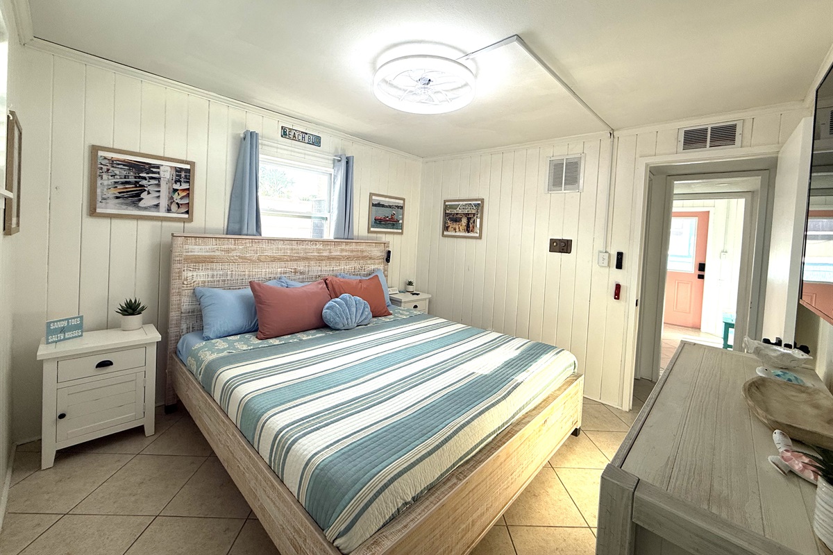 Primary Bedroom Alternate View with King Bed & Retro Photos & 65" TV