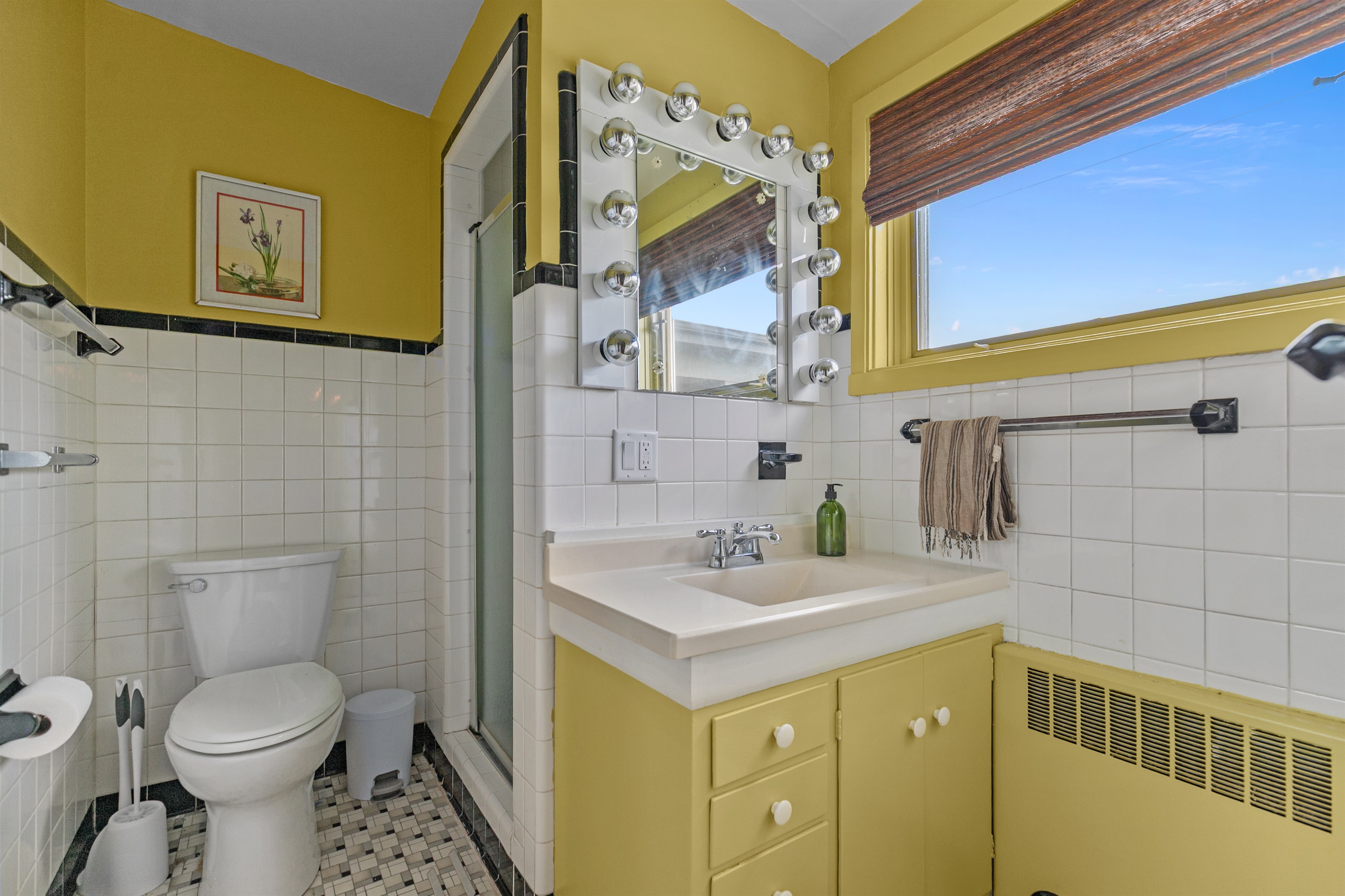 This bathroom blends classic character with modern design, offering updated finishes alongside its original charm.