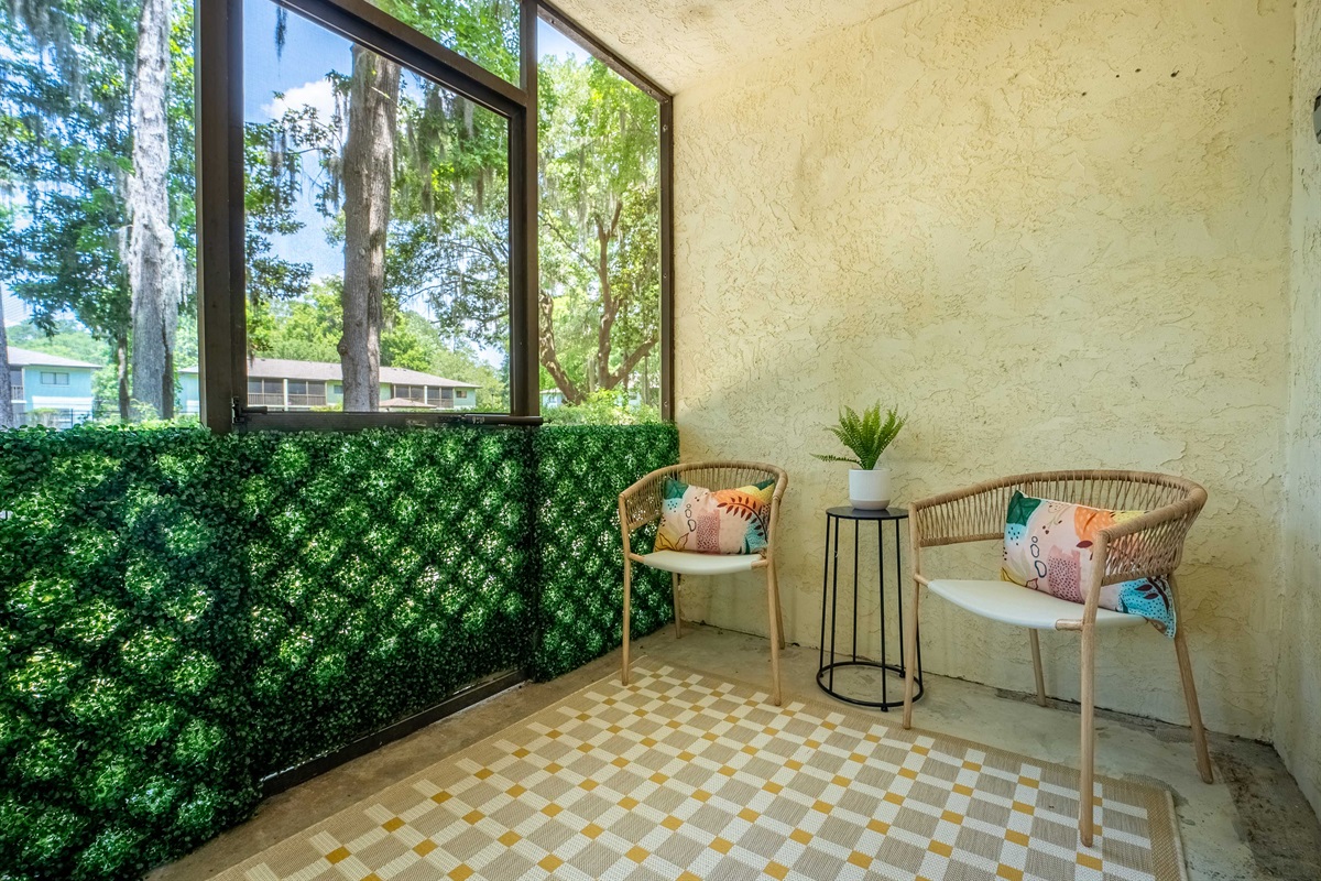 Comfy seating and views of the green space make this the perfect outdoor escape.