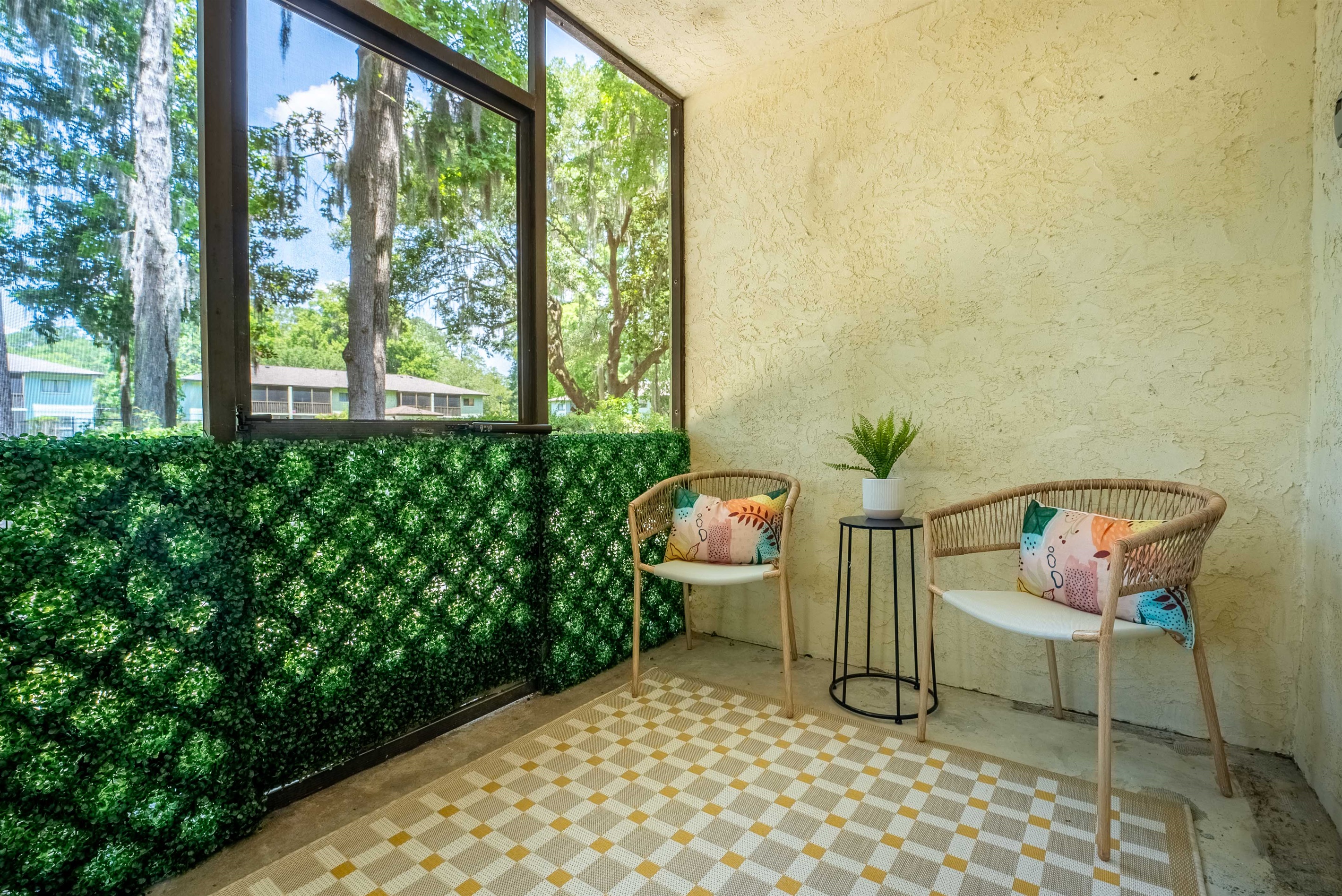 Comfy seating and views of the green space make this the perfect outdoor escape.