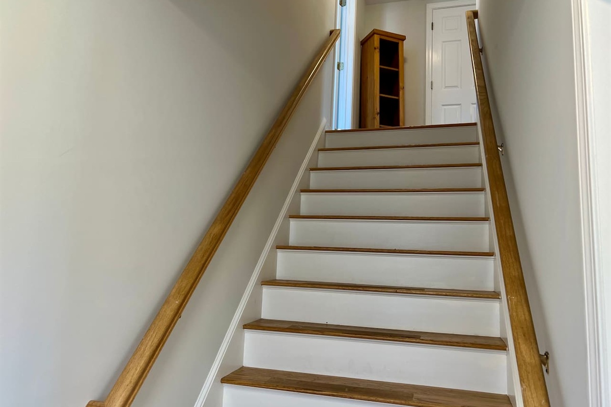 Head upstairs to the bedrooms and another bath