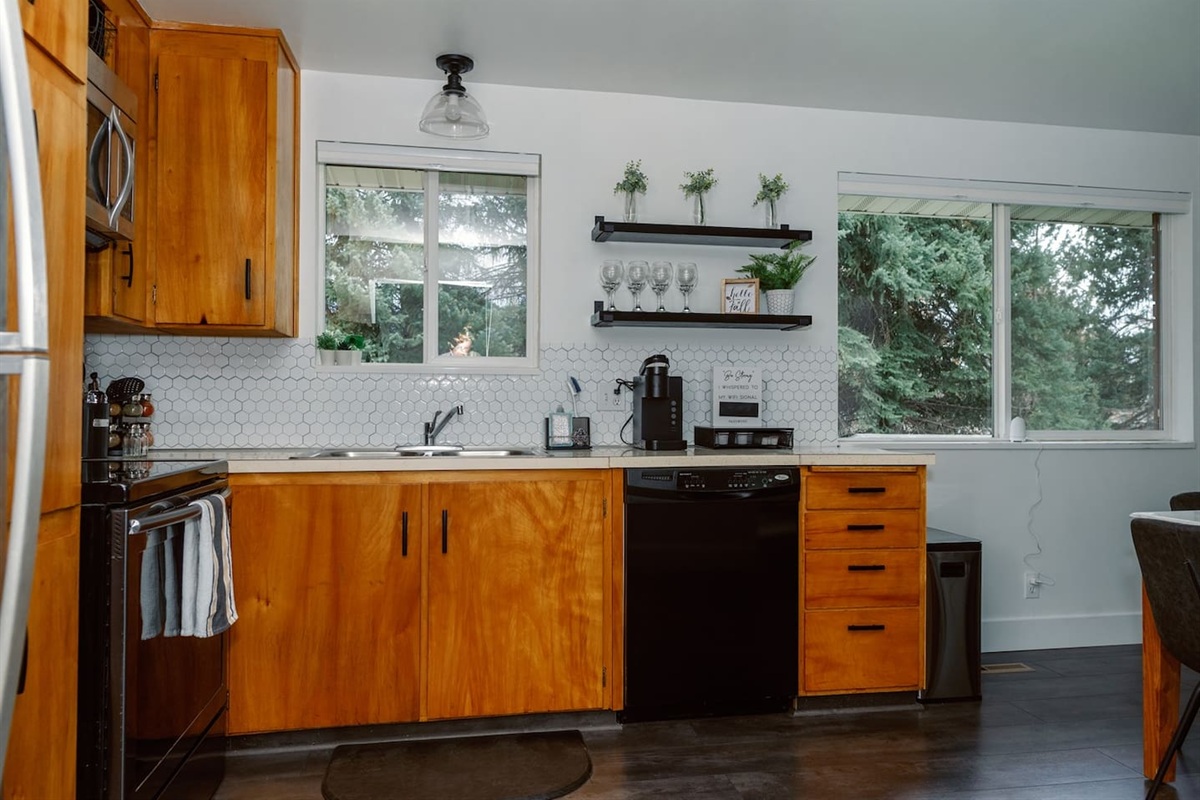 Bright and airy kitchen with original cabinetry and countertops!