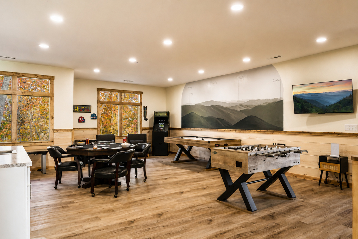 Game room with wet bar, custom mural, television, and tons of games to keep you occupied in evenings, inclement weather, or just whenever! We know the Smoky Mountains are amazing- we don't want you to be disappointed when you spend time here at the cabin!
