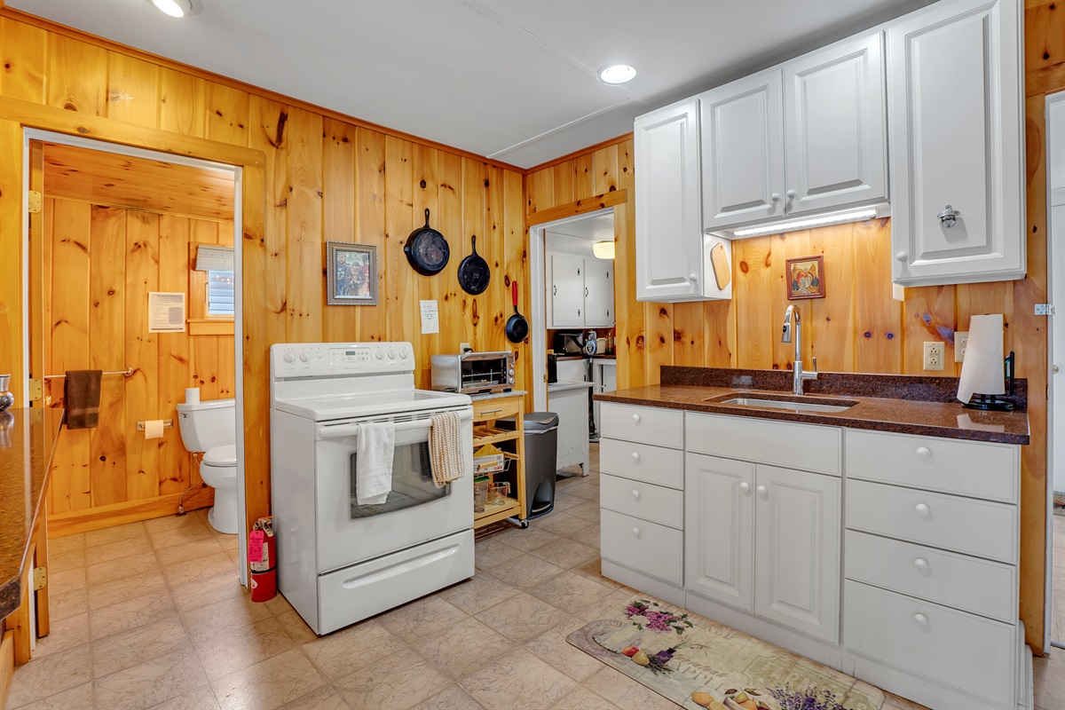 Kitchen with bathroom with shower to the left
