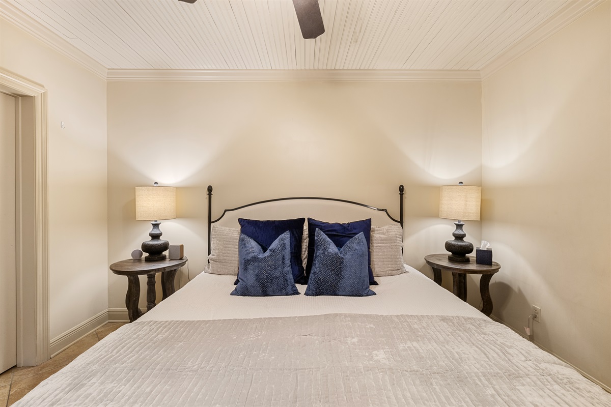 Relax in this elegant haven with plush textiles and soft lighting.