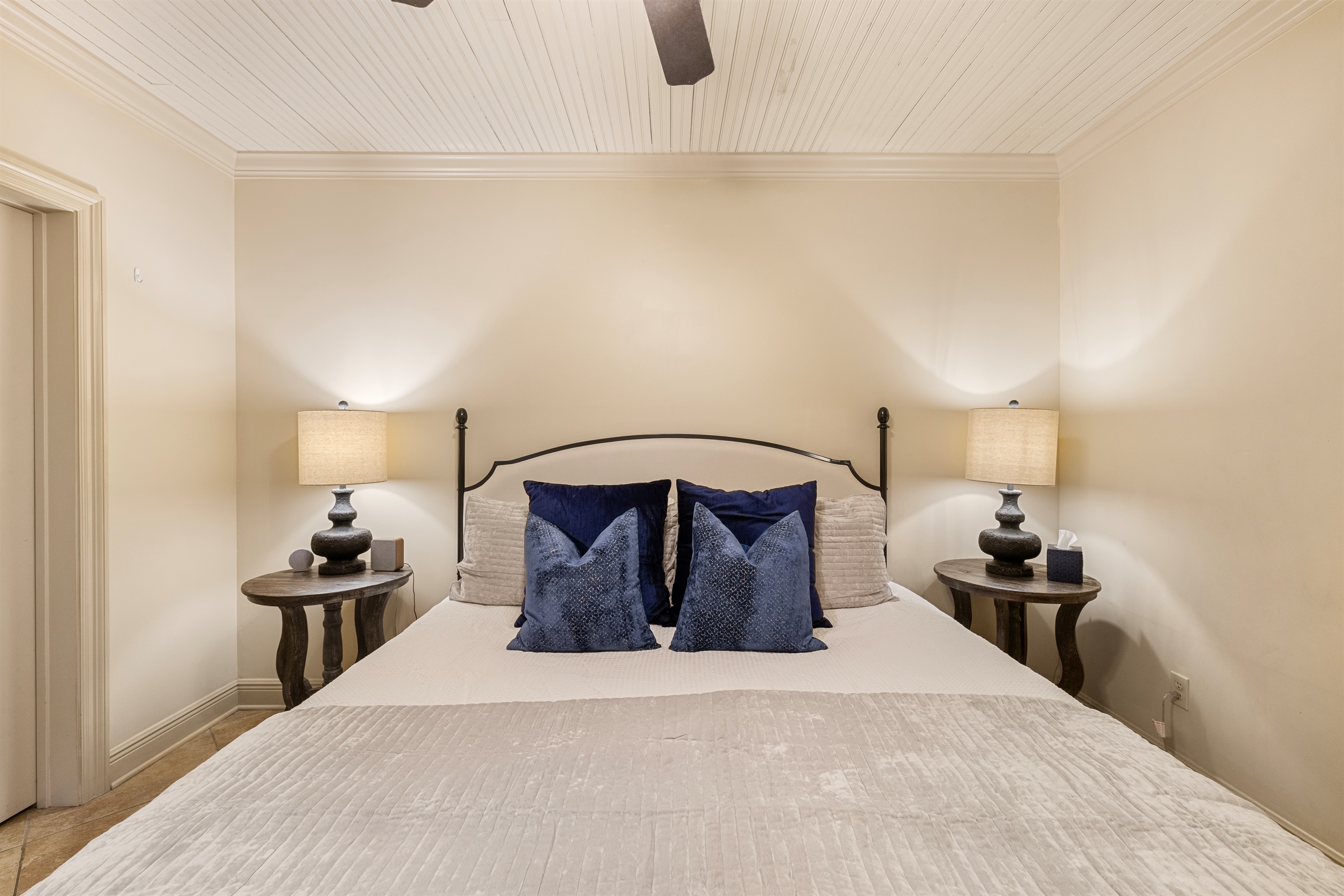 Relax in this elegant haven with plush textiles and soft lighting.