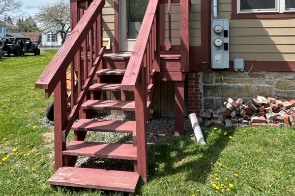 Rear stoop leads to back yard.