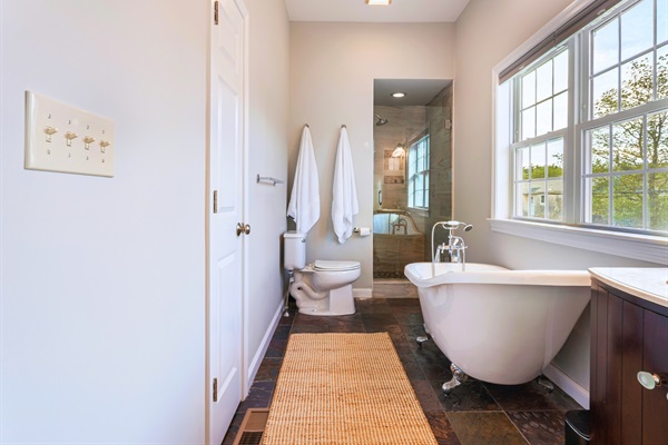 Your ensuite bathroom features a luxurious bathtub, perfect for a tranquil escape after a busy day!