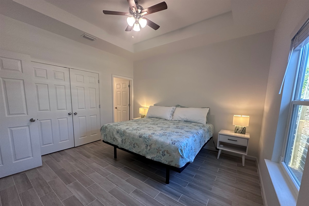 Main bedroom with adjustable bed and en-suite bathroom