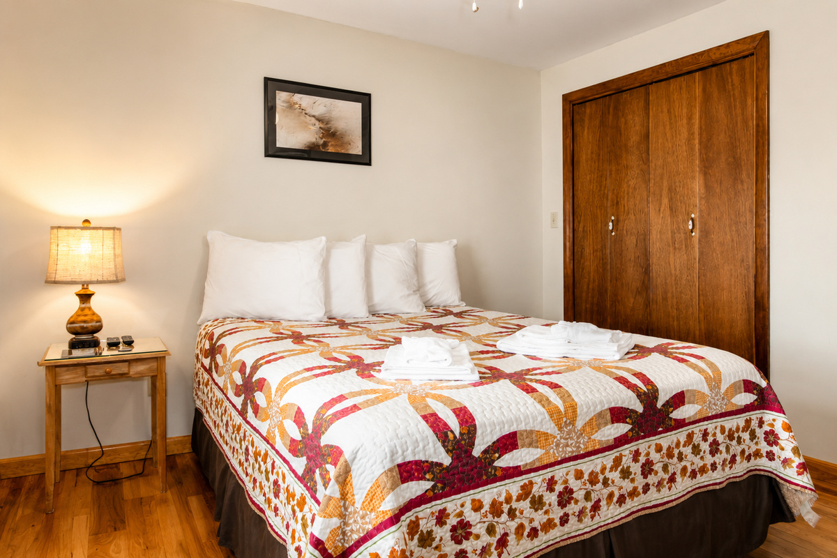 Bedroom with queen bed.  4 pillows for a restful night sleep
