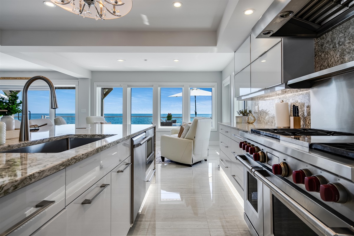 A chandelier floating like a cloud above the island.