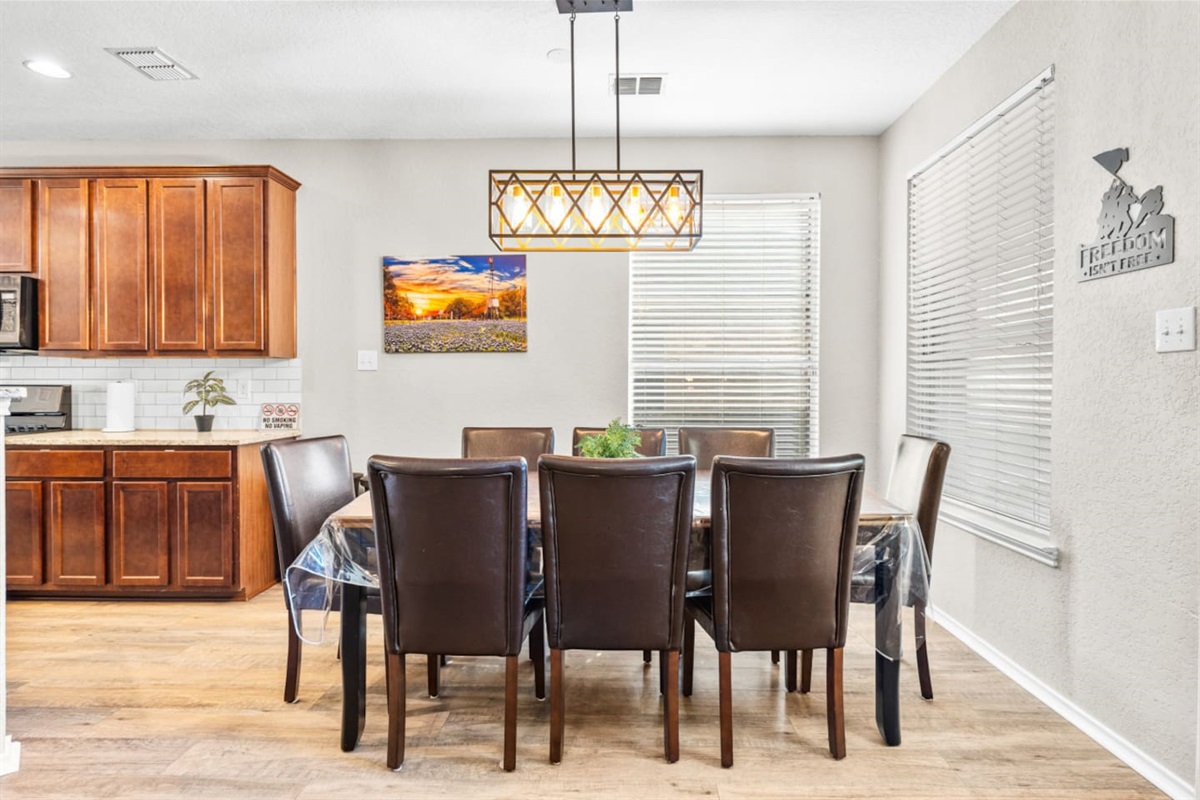 Modern open kitchen leading directly into the dining room for 8, offering a seamless setup for cooking, hosting, and connection.