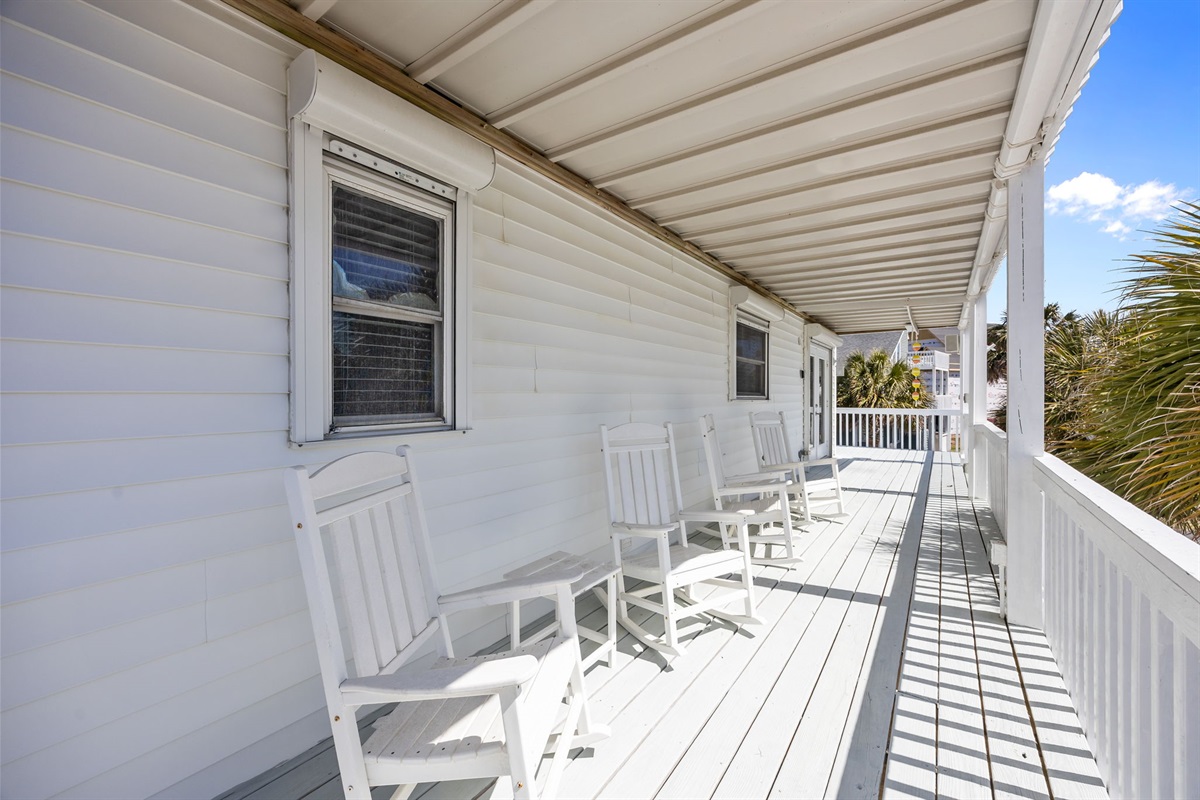 Relax on the balcony and enjoy the neighborhood and palm tree views
