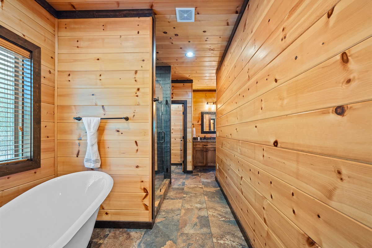 Bathroom suite with soaking tub and walk-in shower.