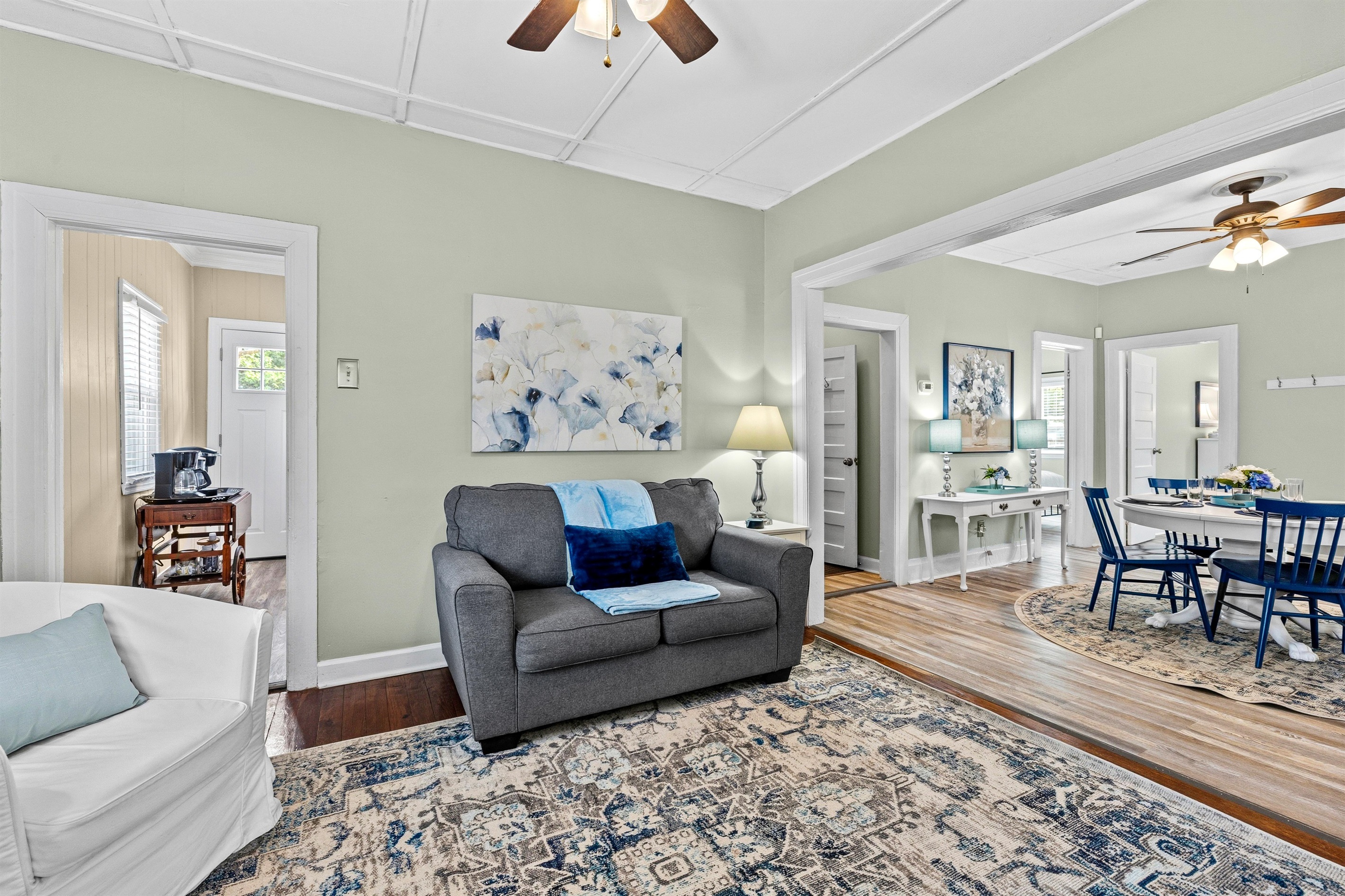 The living room is connected to the dining room