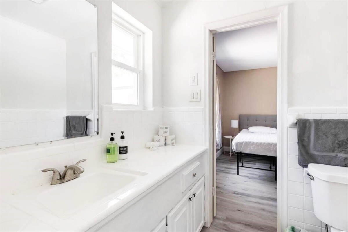 Jack and Jill bathroom with two access doors between the two-queen bedrooms, with the ability to lock both doors from the inside.