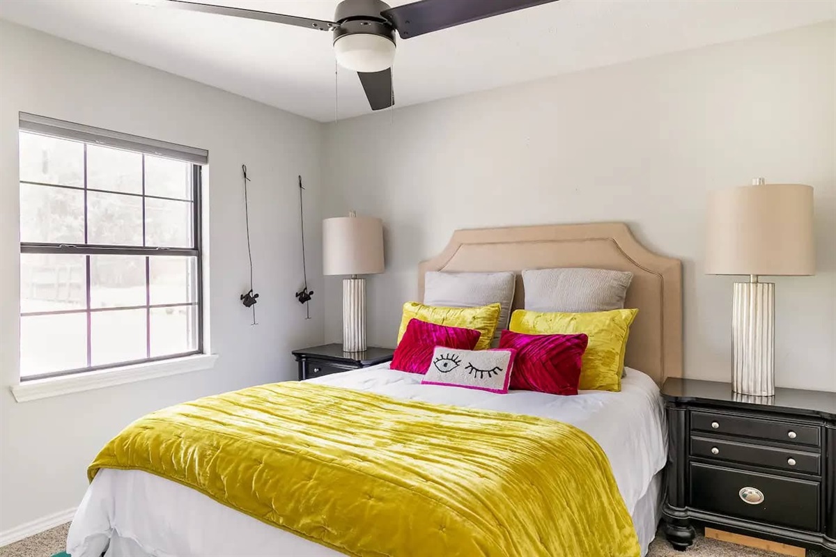 Guest bedroom with queen bed and fun tones.