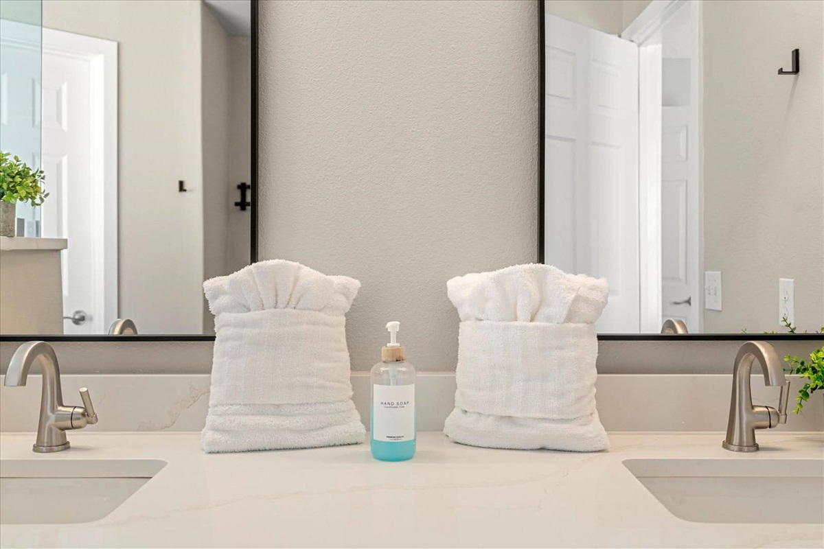 Towels, hand soap, shampoo, conditioner and body wash are provided.