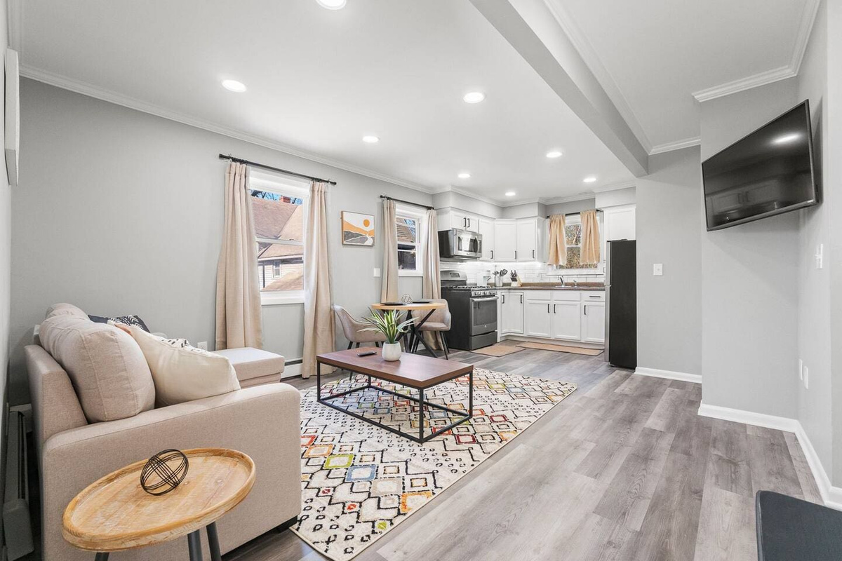 Open view of the living and kitchen area, seamlessly blending comfort and functionality for a spacious, airy feel.