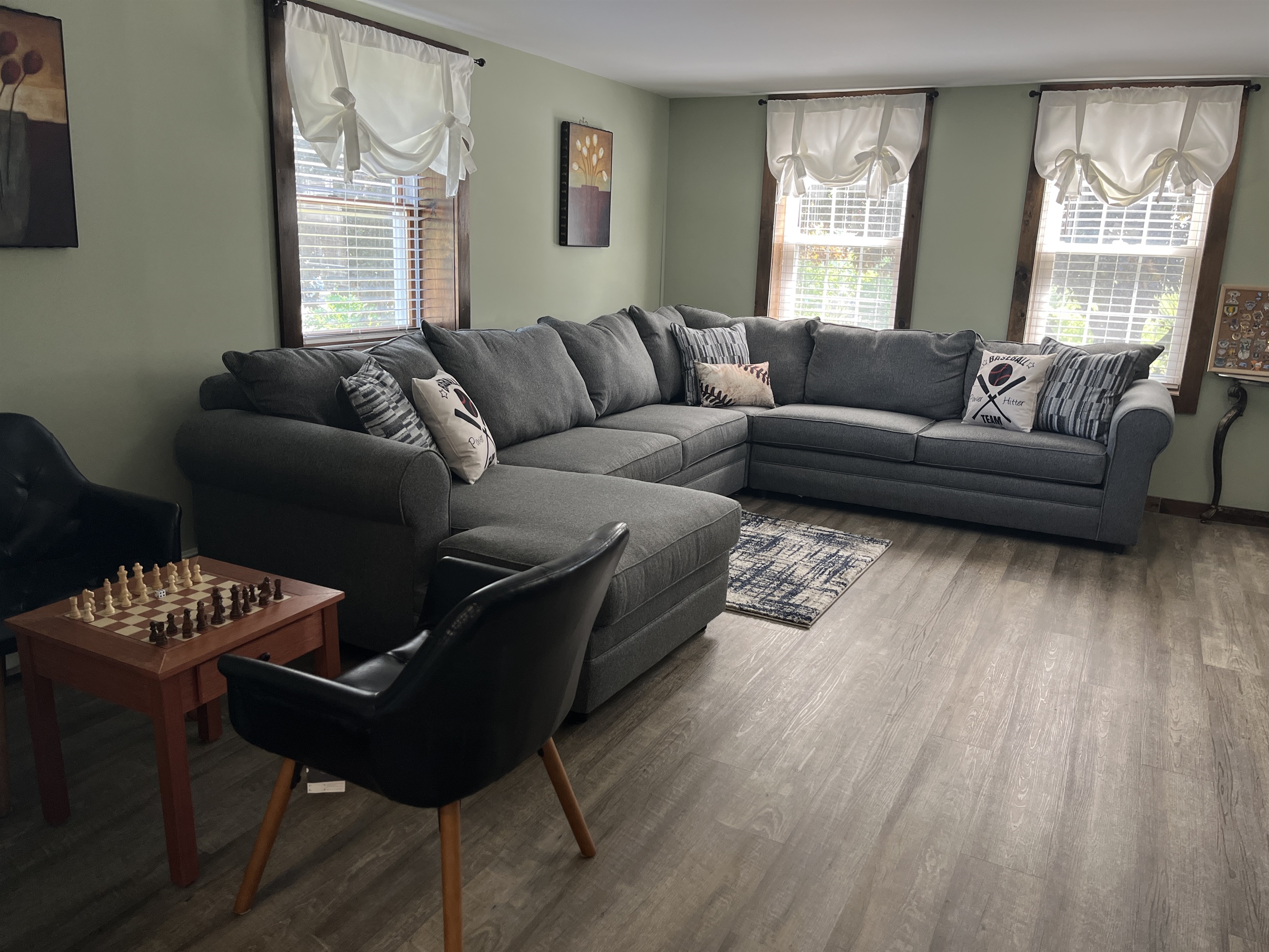 Roundtripper main living room with large sectional couch and game table, chess anyone?