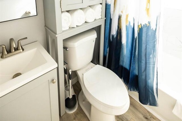 The modern bathroom features a tub/shower combo and thoughtful touches to make your stay comfortable.