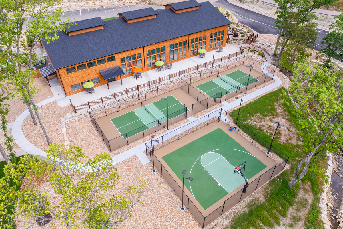 Pickleball courts, basketball court and play area for kids of all ages.