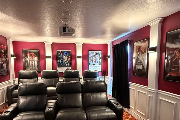 Comfy reclining seats with cup holders with surround sound behind for the most immersive movie experience.