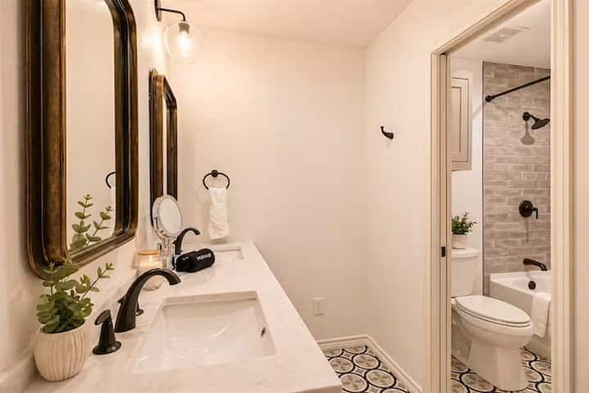 Modern bathroom with clean finishes and bathtub shower combo