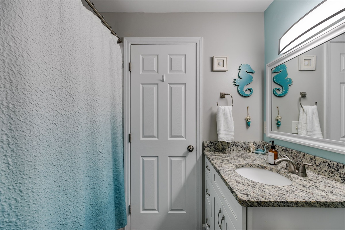 Conveniently located between the upstairs bedrooms, this shared bath combines comfort and style, making it easy for everyone to feel at home.