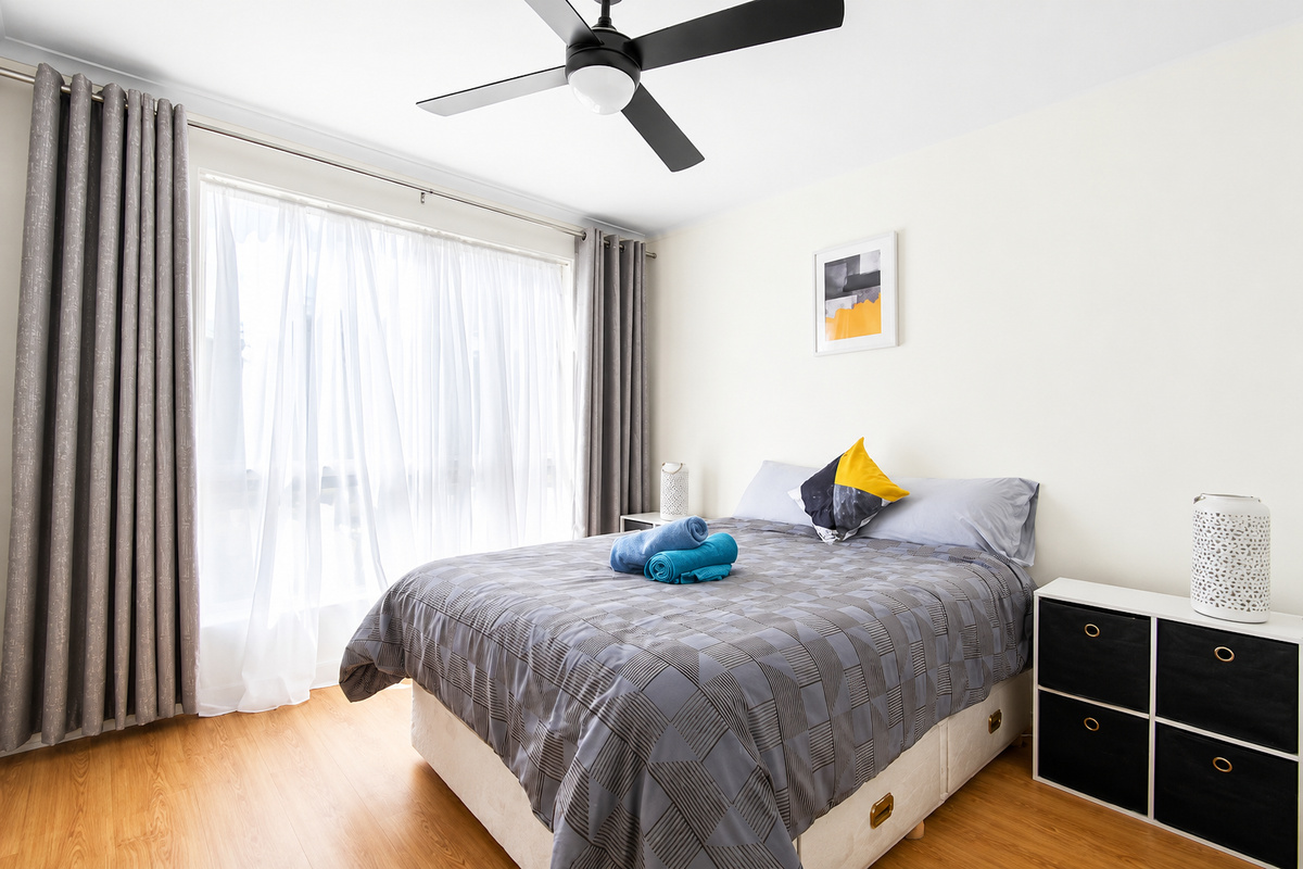 1 Double bed Bedroom - The third bedroom at Carlenes Getaway has a double bed, ceiling fan and soft natural light for a simple, comfortable Loch Sport stay.