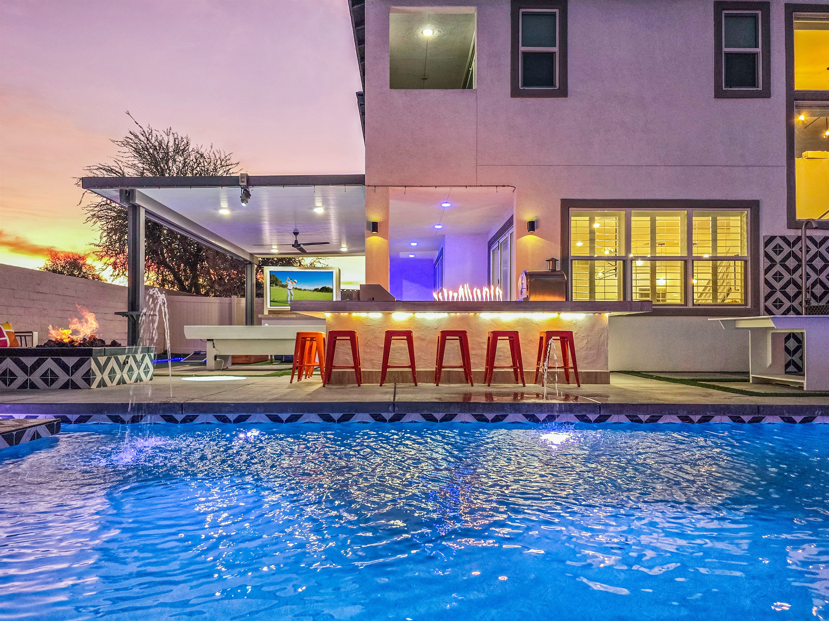 This backyard isn't just about a pool. It's about entertaining the entire family! The Brooklyn has three different fire features outside, including the bar countertop fire.