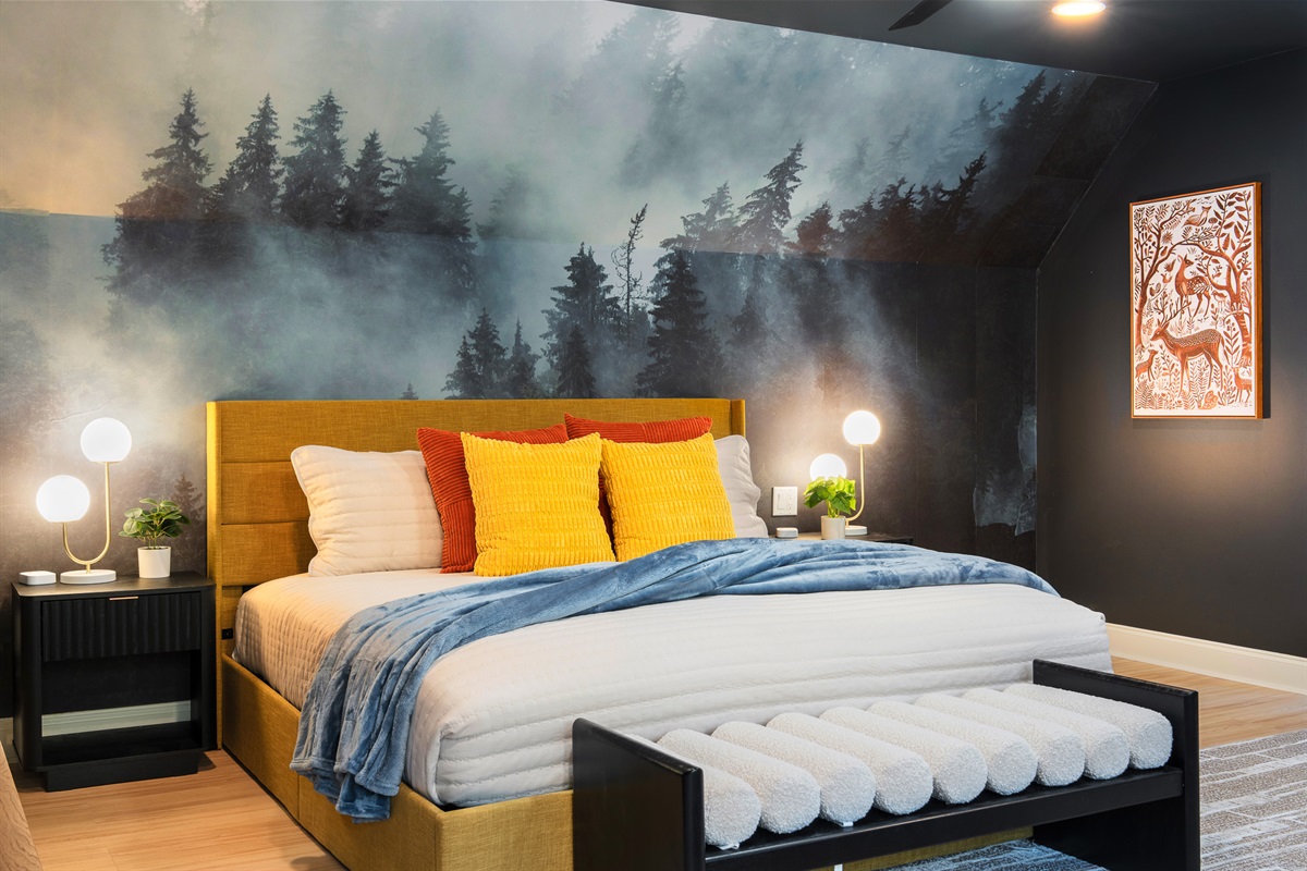 Large bedroom with statement wall and natural light - one of several thoughtfully designed spaces