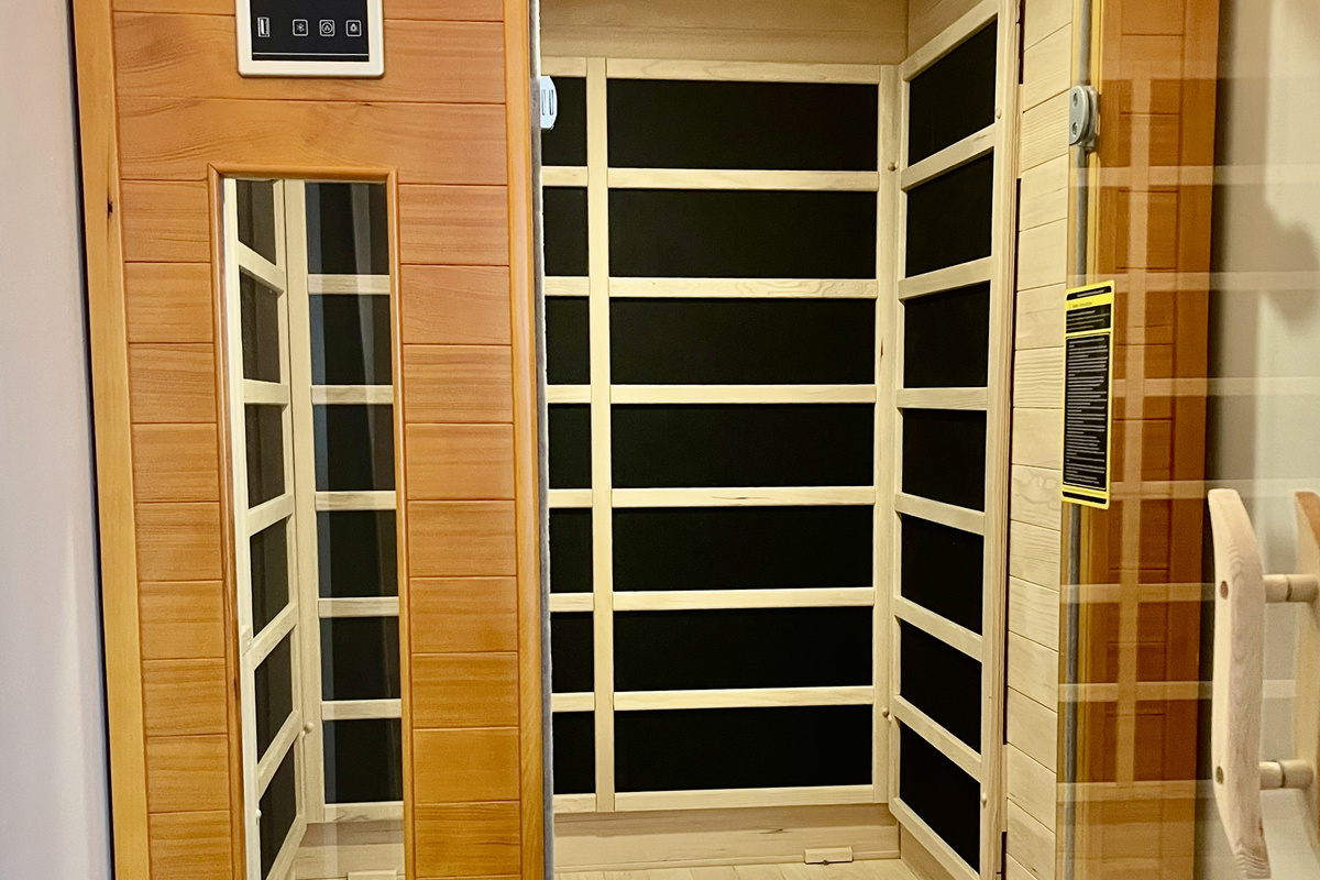Unwind in the 1–2 person infrared sauna, set to calming blue and green light.