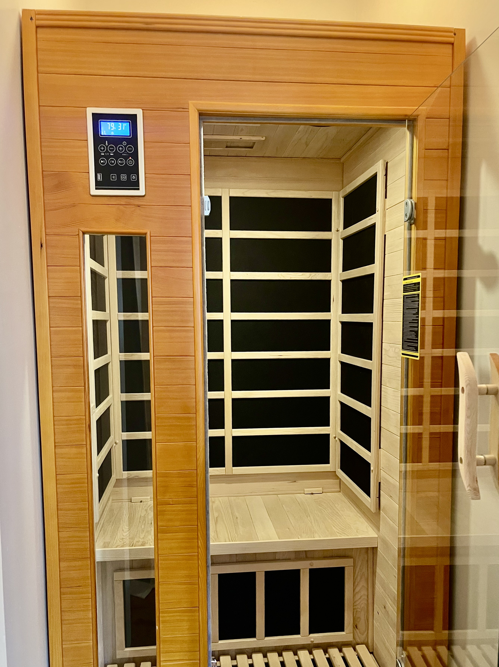 Unwind in the 1–2 person infrared sauna, set to calming blue and green light.