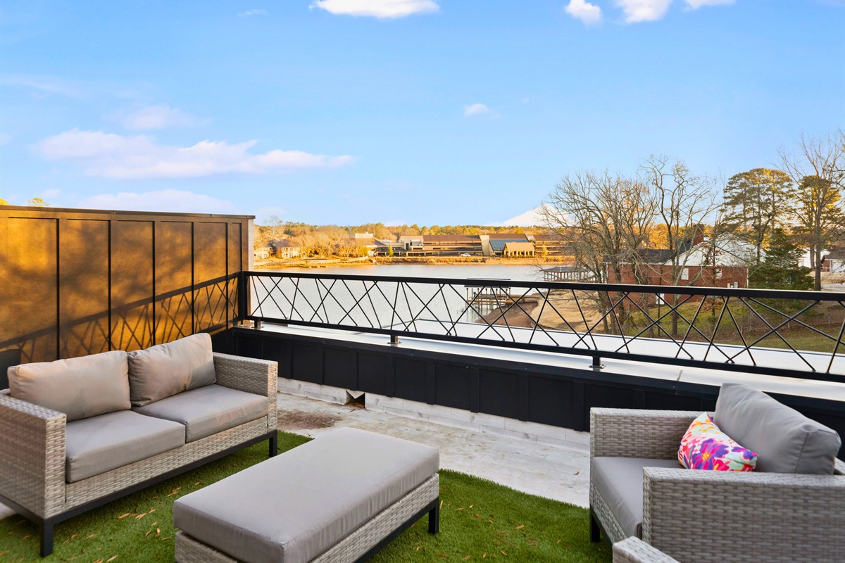 Step outside to this inviting seating area, where you can sip your morning coffee, enjoy a good book, or watch the sunset with stunning lake views as your backdrop.