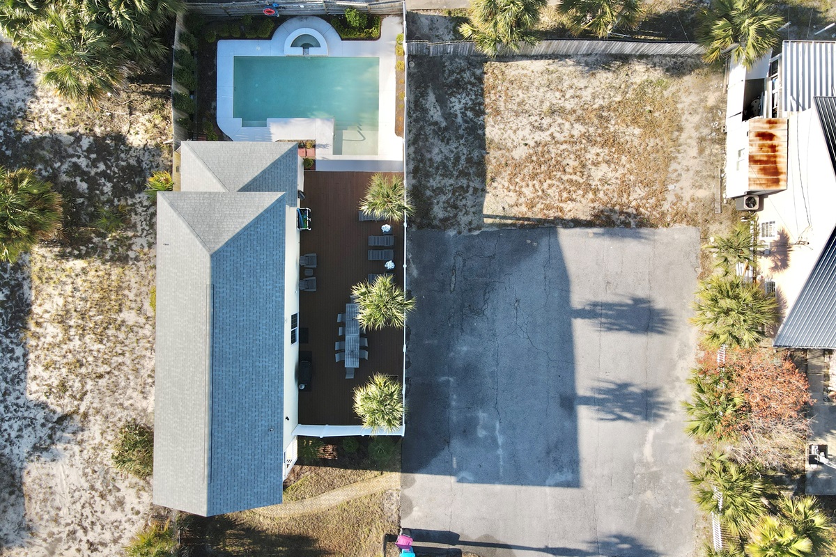 Overhead view of house and private parking lot