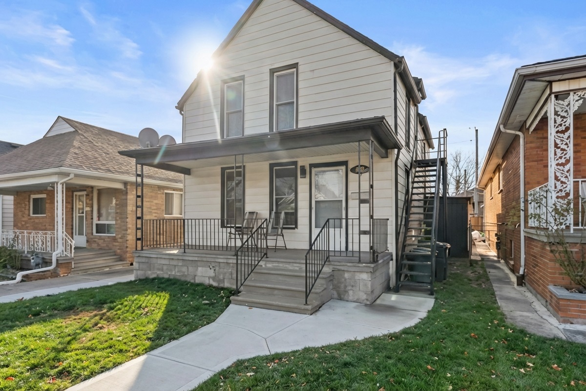 Front of the property showing the staircase to the upper unit. 