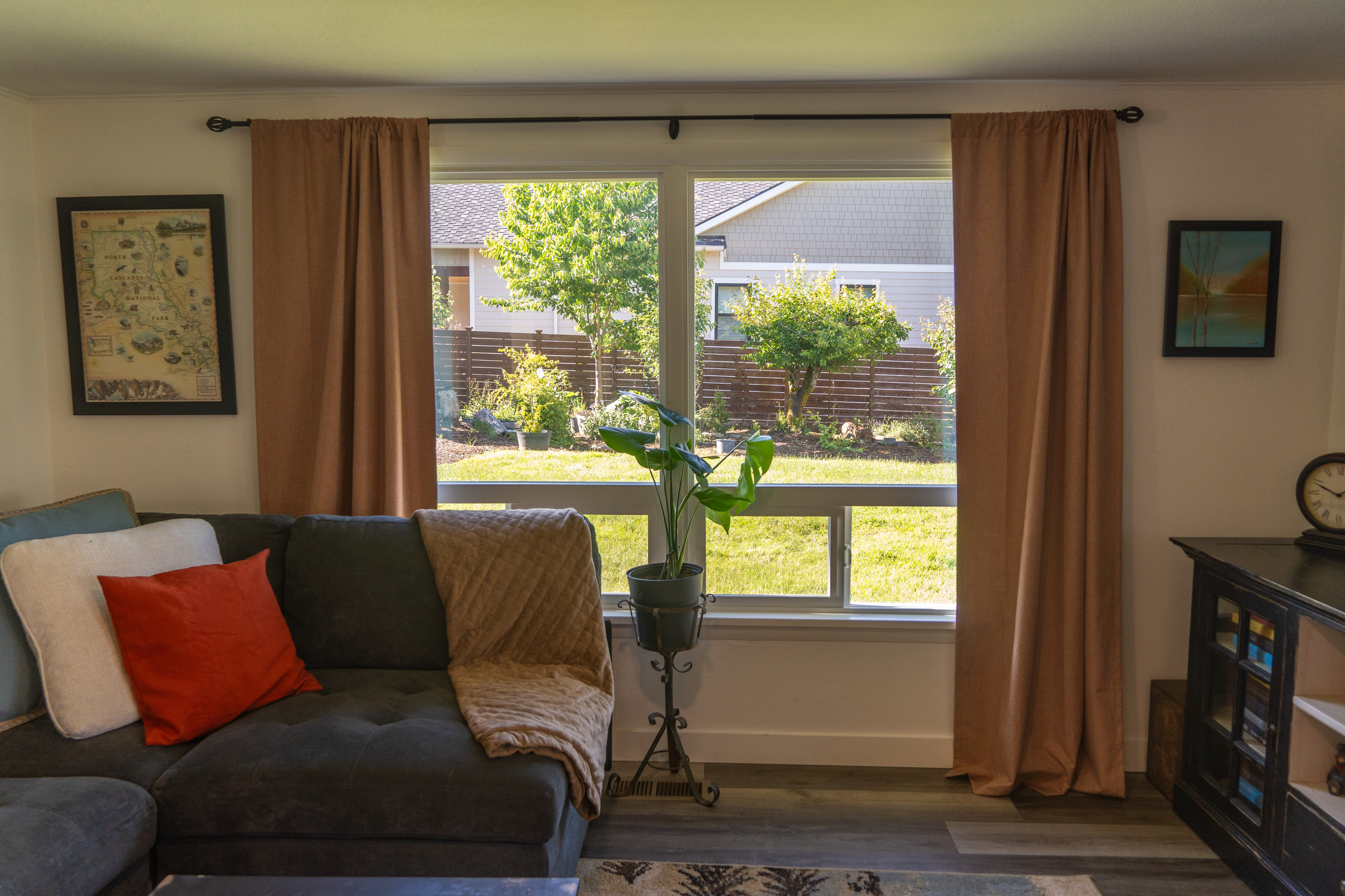 An oversized, inviting couch with plush pillows and throws offers the perfect spot to relax, unwind, and enjoy the view or a show.