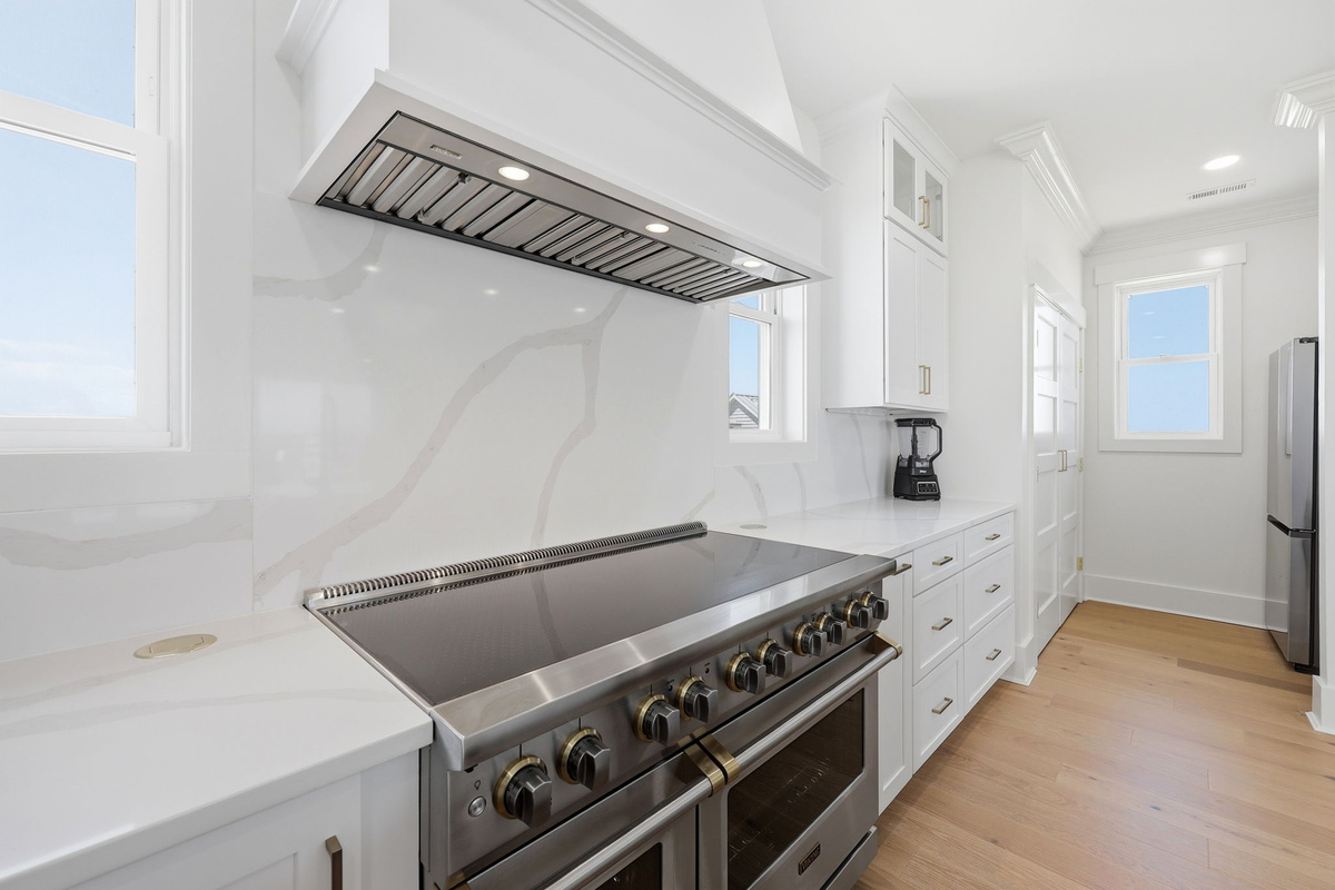 Bright open-concept kitchen connecting dining and living areas for effortless group gatherings