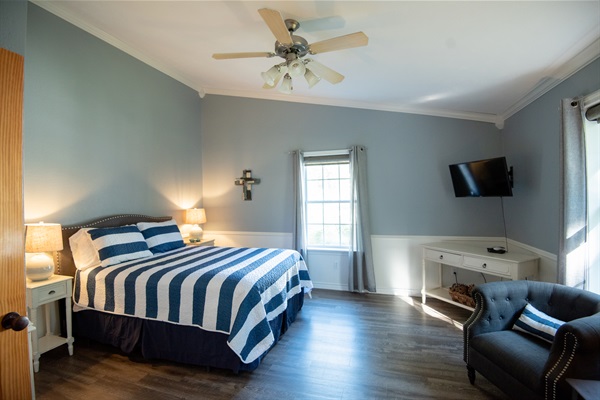 Each queen bedroom includes seating and flat screen tv