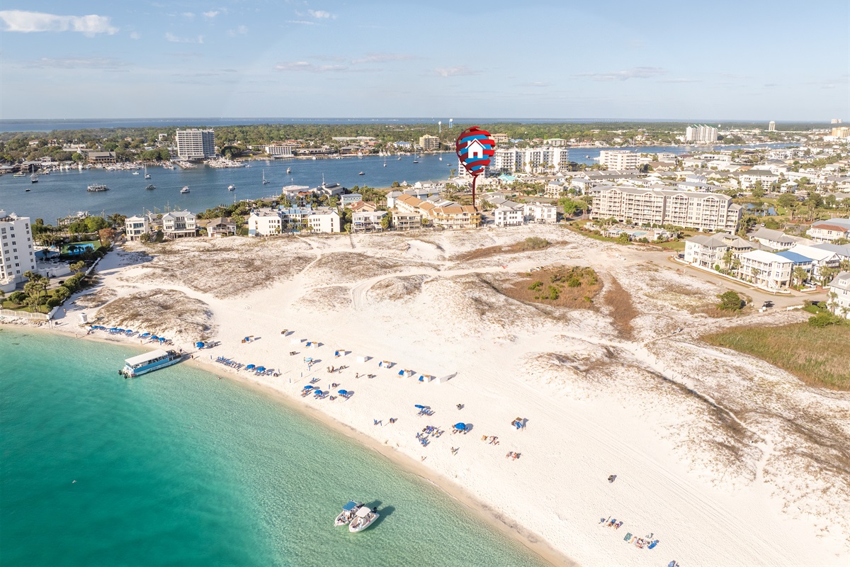 Aerial view showing just how close The Gathering Place is to the beach, the jetties, and Destin Harbor. Walk to the sand in under a minute.