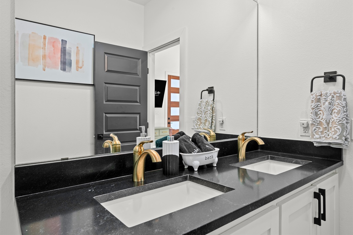 Dual sinks paired with contemporary fixtures make mornings easier and more comfortable when sharing the space.