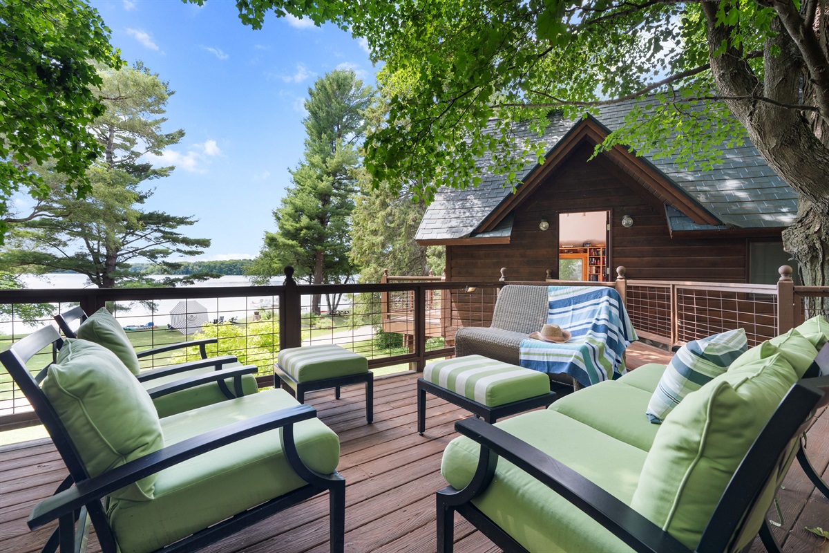 Unwind on the spacious 1,250 sq ft shaded deck—perfect for sipping afternoon drinks, chatting with friends, or napping in the breeze—all while soaking in the peaceful views of Lake Ann. 