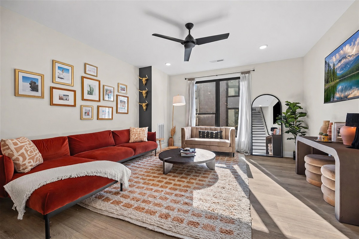 Relax in your large and luxurious living room, which includes a large velvet sectional, 65 inch TV with streaming apps, and plenty of thoughtful touches to make this place feel just like home. 