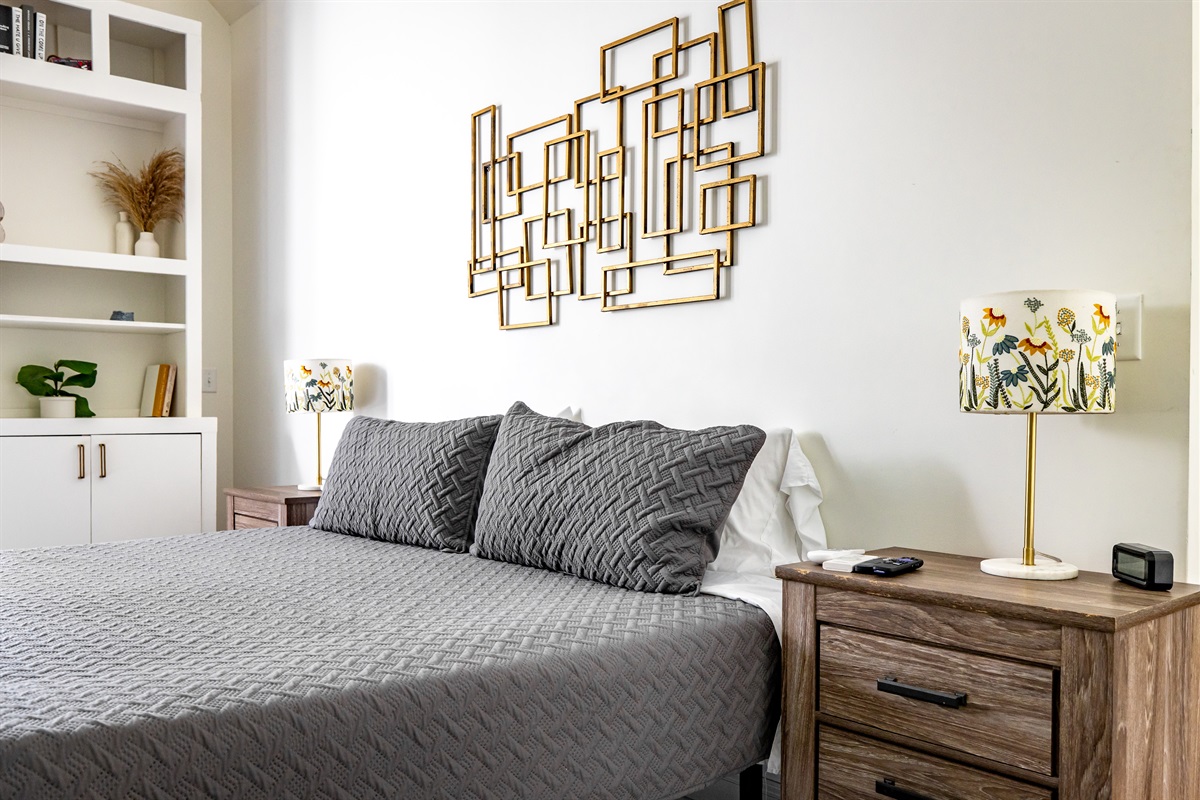 Main bedroom with king bed, TV, desk