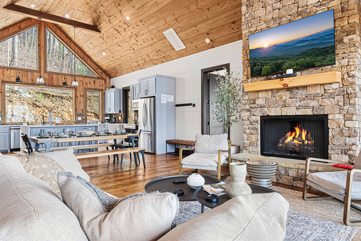 The dining table comfortably seats 8, with additional seating at the kitchen island