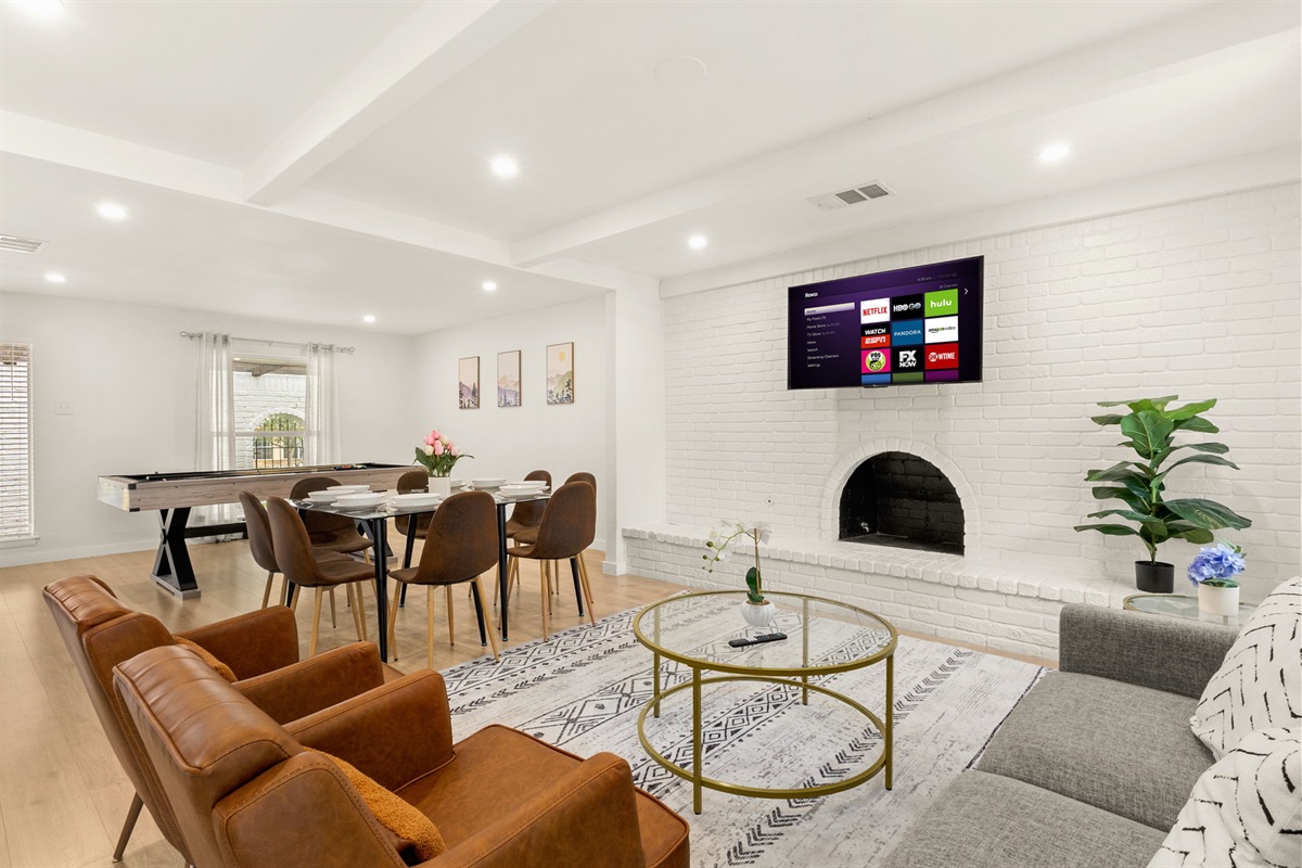 Cozy living area with fireplace & smart TV—perfect for movie nights and lounging ✨
