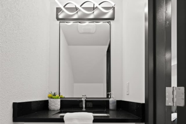 1st floor half bathroom offers modern sophistication along with convenience.