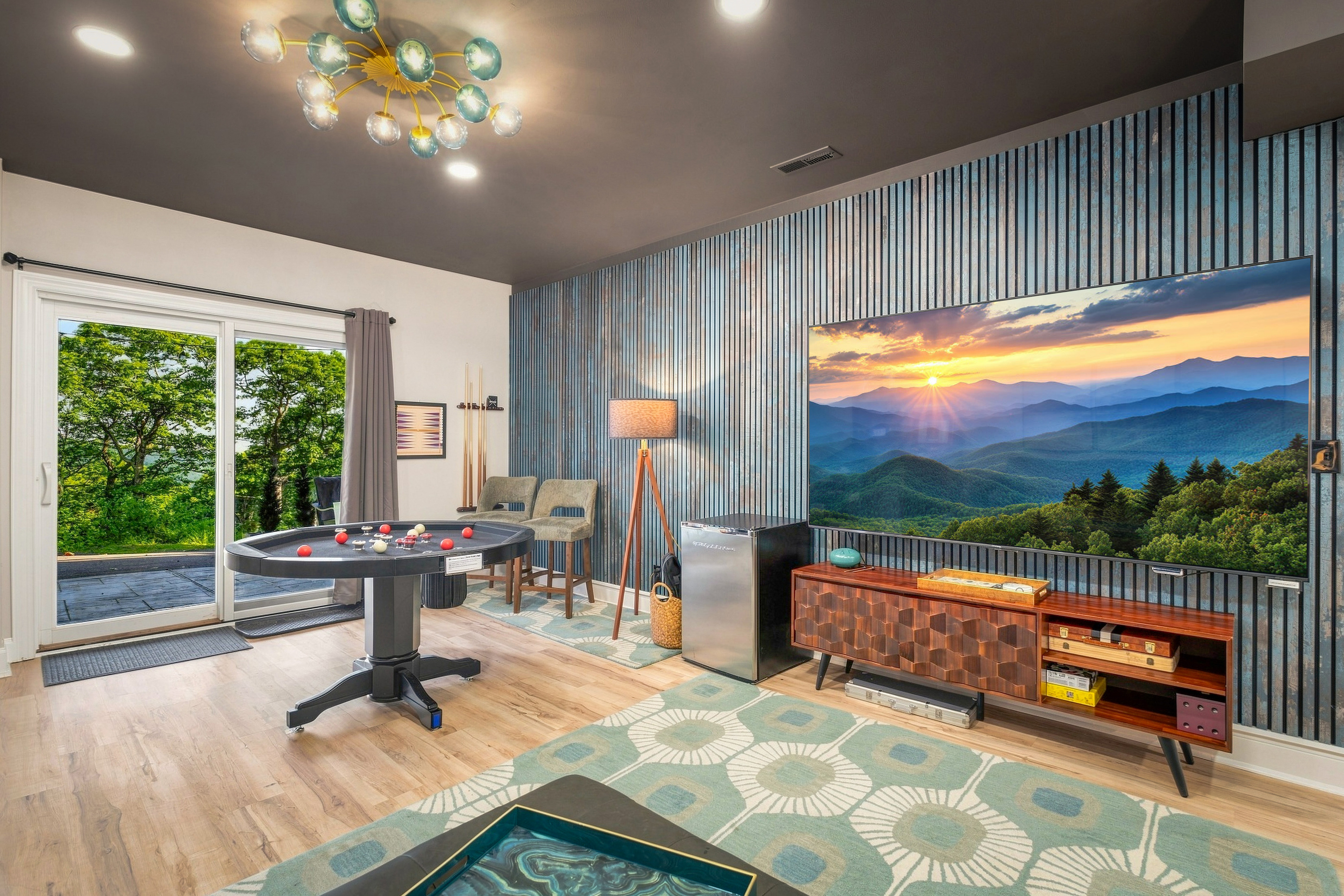 Host movie nights or poker marathons around the 85” smart TV in a space styled for comfort, cocktails, and competition