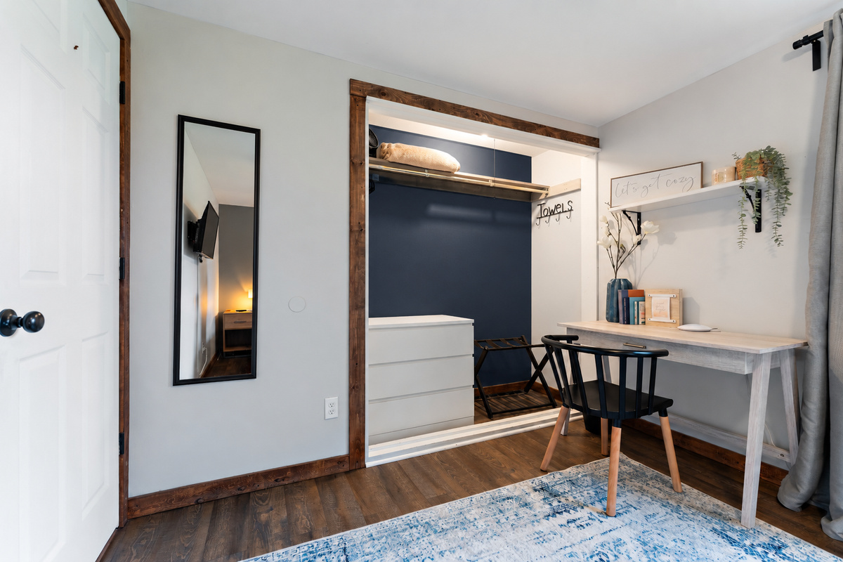 A designated workspace is in this queen bedroom.